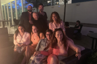 Group photo at dusk, men and women